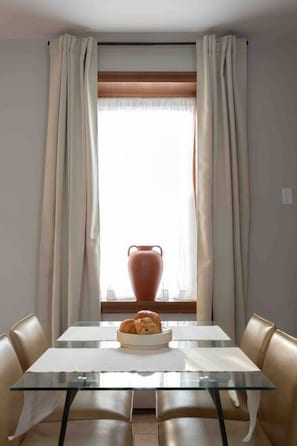 Downtown New Haven Vacation Rental Near Yale – Enjoy a fully equipped kitchen with cookware, coffee essentials, and dining for four, making your stay both convenient and comfortable.