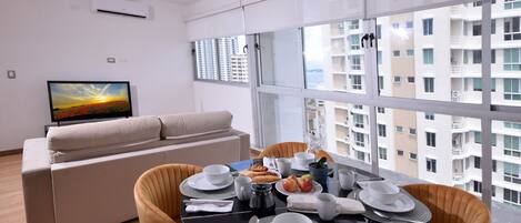 LIVING/DINING ROOM WITH FLOOR TO CEILING WINDOWS FOR BETTER VIEWS