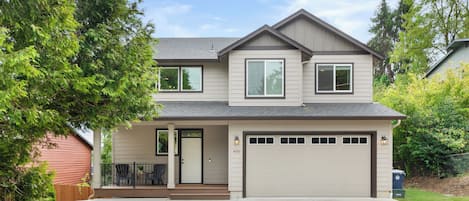 Front driveway with parking for at least 3 vehicles. 