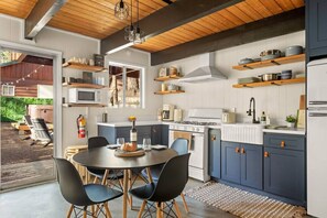 Fully stocked kitchen with modern appliances and a drip coffee maker.