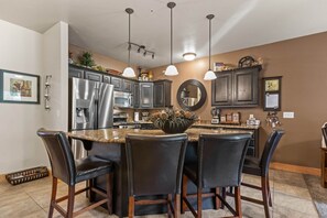 Bear Hollow Lodges 1304:  Meal preparation is not only for the kitchen. The countertop seating offers room for helpers and eaters.