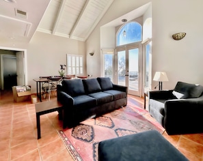 The living room has a sofa sleeper, gas fireplace and smart TV