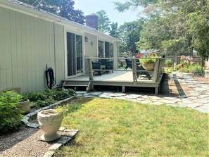 Back deck with outdoor seating and gas grill.