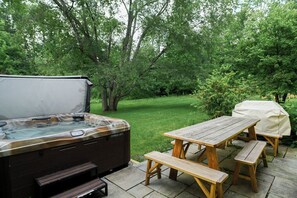 Enjoy the patio, hot tub, and gas grill