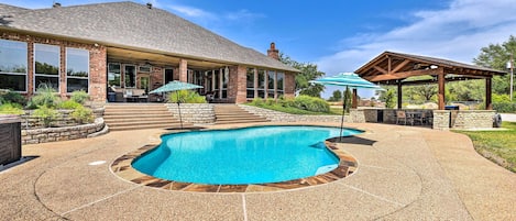 Private pool, patio and outdoor kitchen with bar frig, sink and two grills