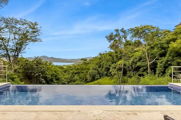 Infinity pool with view of the ocean and mountains