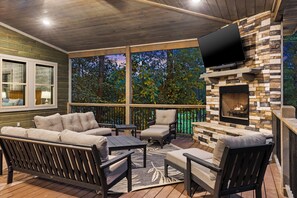 Reconnect with friends and family by the deck fireplace!