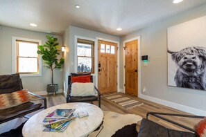 The view of the front door of the home which opens up to the stylish sitting area.