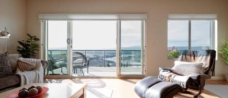 Living area drenched in natural light, warmth and breathtaking views