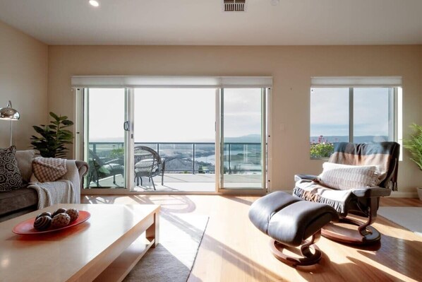 Living area drenched in natural light, warmth and breathtaking views