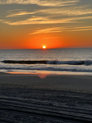 Rolling wave at sunrise