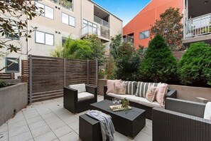 A large private courtyard with an outdoor setting.
