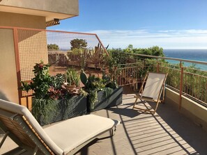 Sky, Furniture, Plant, Property, Water, Chair, Cloud, Outdoor Furniture, Wood, Shade