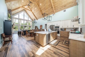 Open concept kitchen and living room connect everything