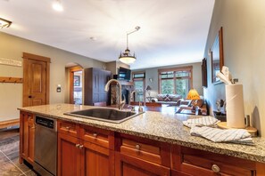 Full kitchen with stainless steel appliances and granite countertops