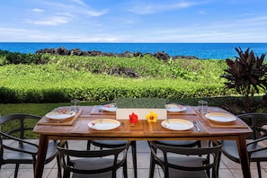 Savor al-fresco dining at the lanai, where the gentle breeze complements every bite under the starlit sky.