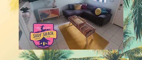 Spacious surf style living room with smart television and sleeper sofa