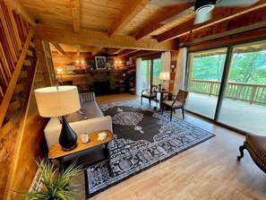 Cozy up in the large living room of this modern log cabin.