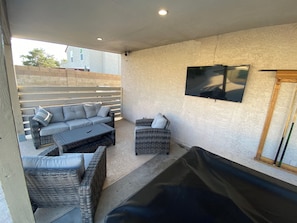 Amazing outdoor living room with TV. Pool Table.
