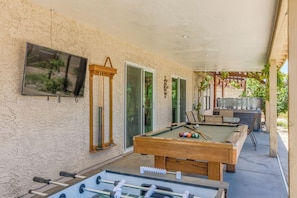 Large covered deck (no foosball) Now outdoor living room-TV-billiards-dining.