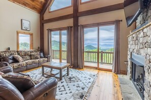 The main floor living room is spacious with plenty of windows to let in the natural light and take in the views.