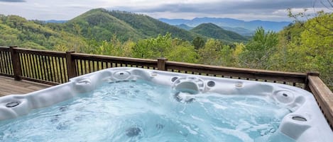 Relax in our hot tub while taking in the expansive mountain views.