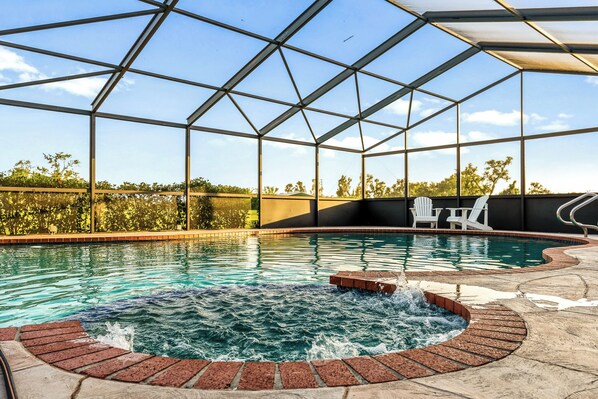 Soak in the Florida sunshine from the comfort of premium poolside loungers, or unwind in the shaded patio area complete with cozy outdoor seating. Surrounded by lush greenery and peaceful views, this space offers the perfect blend of privacy and paradise.