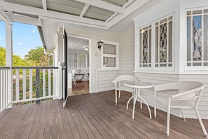 The front deck + sunroom entry...
