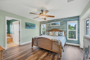 King bed in the master bedroom with ensuite bathroom and lanai access