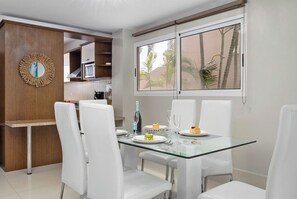 Enjoy delicious meals and quality conversations at the cozy dining table with seating for four.  This  space offers the perfect setting for shared moments