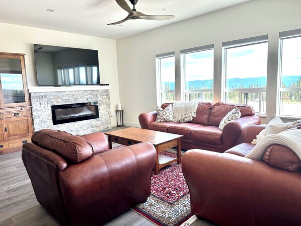 Living room with views over the Monashee mountains. 75 inch smart TV with cable.