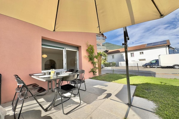 Private garden with table and chairs