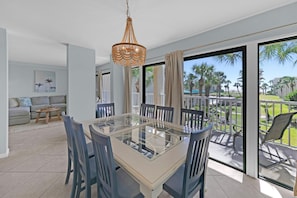 Dining area with access to private balcony and Gulf views
