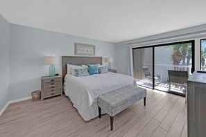 Master bedroom with access to the private balcony and Gulf views