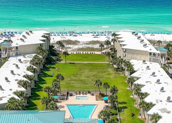 Aerial view of the pool to the beach. The courtyard is unlike any other property