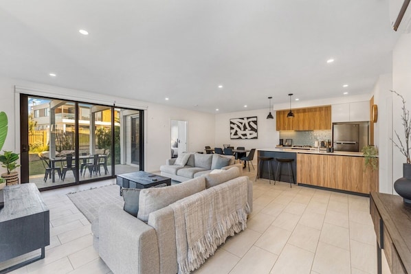 Open plan living, dining and kitchen space.