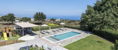 Enjoy outdoor villa living: pool, barbecue, sea views, Kids play while u relax