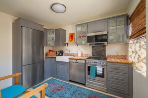 Place setting for up to four and all appliances you need to prepare a nice meal!