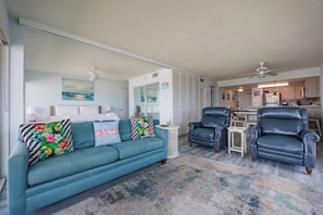 Living area with queen size sleeper sofa and comfy chairs