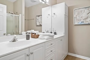 Ensuite primary bath with walk-in shower, double sinks. 