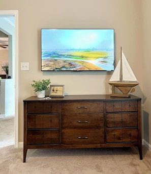 Vintage dresser and 50" smart TV. 