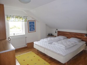 bedroom with double bed and desk