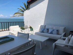 Lanai seating with lounge seating for 5, and table seating for 4 people