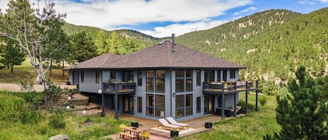 Tucked into the canyon with expansive views & floor-to-ceiling windows.