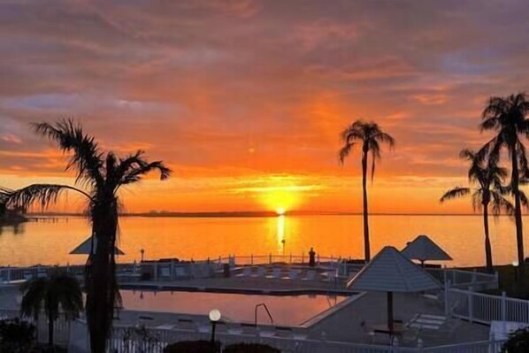 Sunrise view from your primary bedroom & terrace of Boca Ciega/Tampa Bay