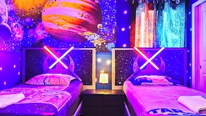 Relax and rejuvenate in our inviting Star Wars themed bedroom, providing you with a comfortable retreat after a day of adventure.