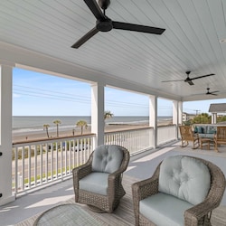 Wicker seating area outside Bedroom 2 with ocean views