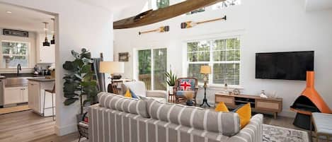 Open floor plan flooded with natural light.