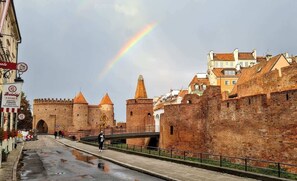 A stunning view of the city’s historic walls, highlighted by a beautiful rainbow.

