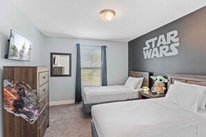 Star Wars themed kids room with 2 single beds